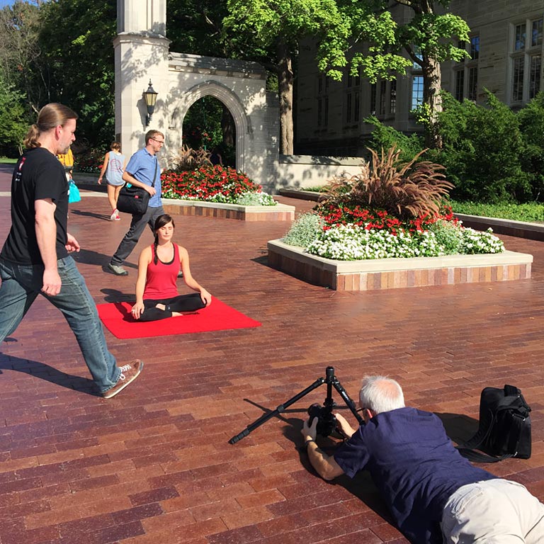 IU Studios photographer on a multi-subject shoot at the Sample Gates on the IU Bloomington campus