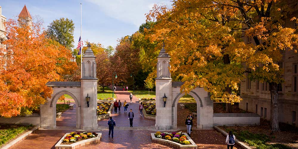 Sample gates in the fall with orange and yellow leaves during the daytime.