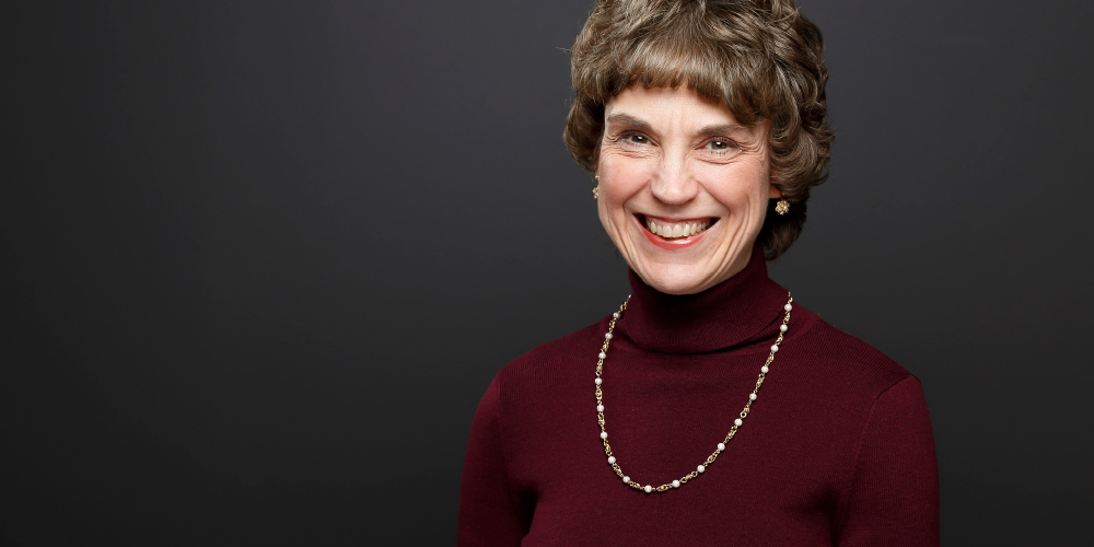 Portrait of woman with dark gray backdrop